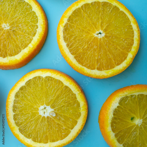 orange slices on a blue background. summer