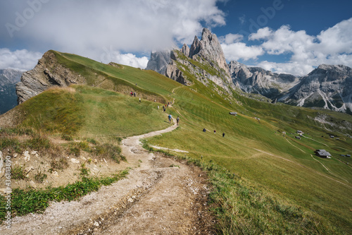 Hiking path and epic landscape of Seceda peak in Dolomites Alps, Odle mountain range, South Tyrol, Italy, Europe.