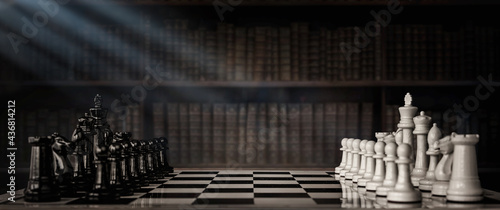 Fotografia Chess pieces on a chessboard against the background of an old cabinet