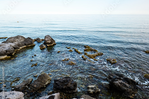 View of the gulf of Giardini Naxos in the evening. Sunset in the sea. Beauty in Sicily as a tourist attraction. Season on mediterranean sea.Ionian sea