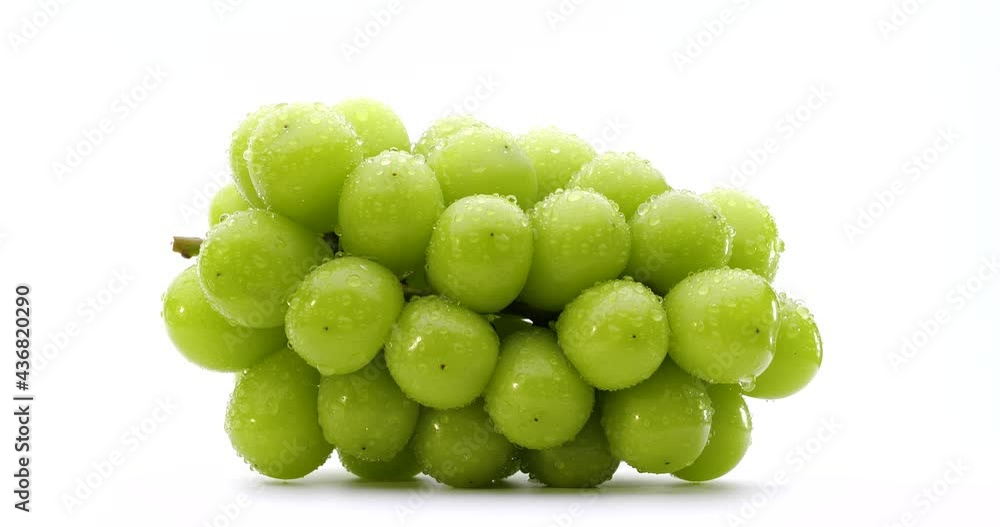 Video of Muscat grapes slowly rotating on a white background. Video of Muscat grapes slowly rotating on a white background.