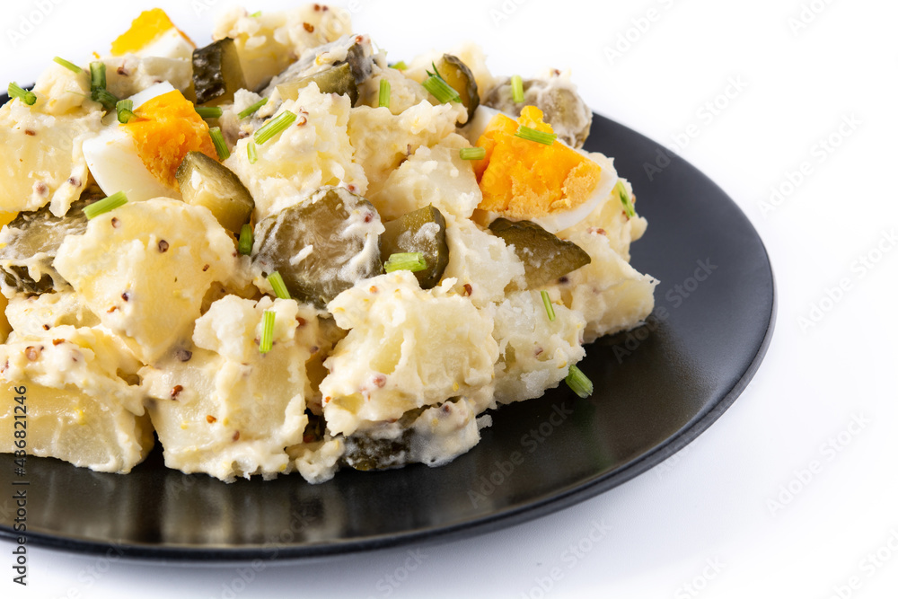 Potato salad with gherkins, egg and mustard isolated on white background Potato salad with gherkins, egg and mustard isolated on white background