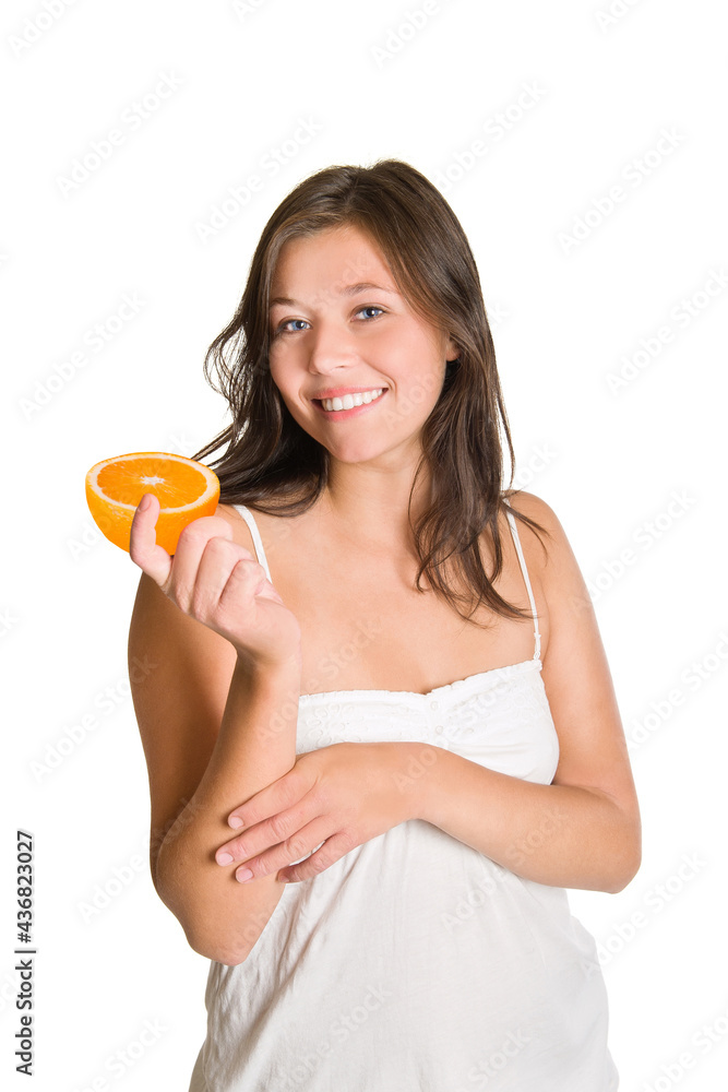 Cute laughing girl holding an orange in her hand, isolated in front of white background Cute laughing girl holding an orange in her hand, isolated in front of white background