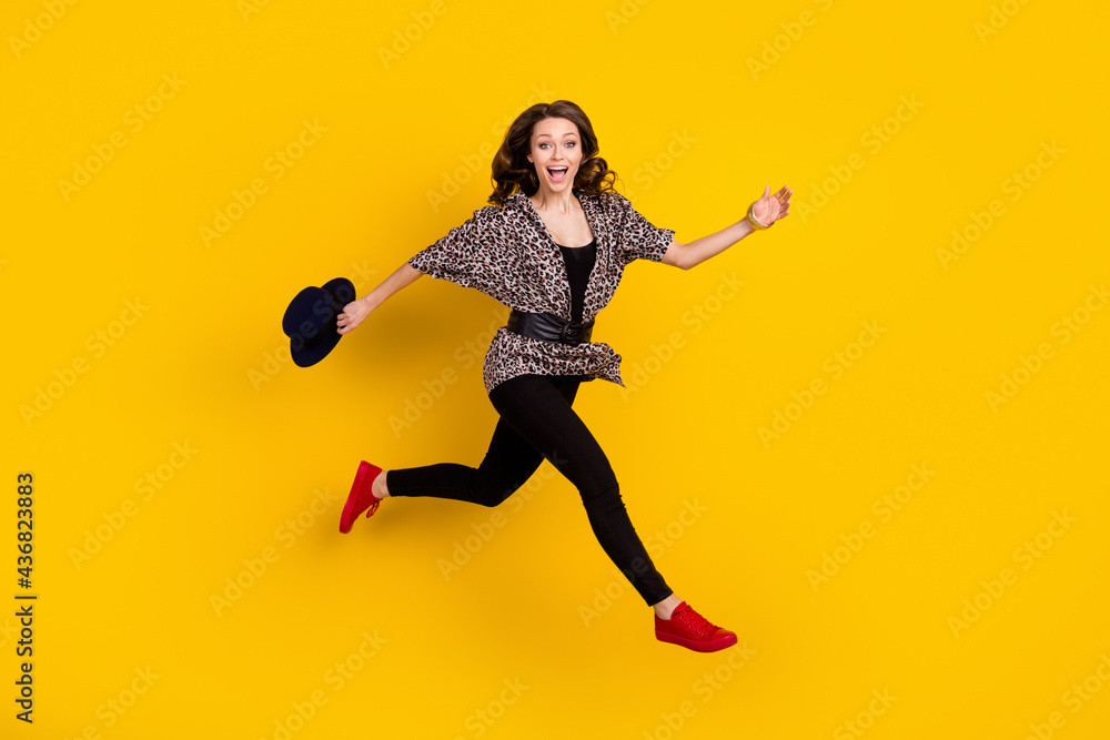 Full body profile side photo of amazed happy young woman jump run empty space isolated on yellow color background