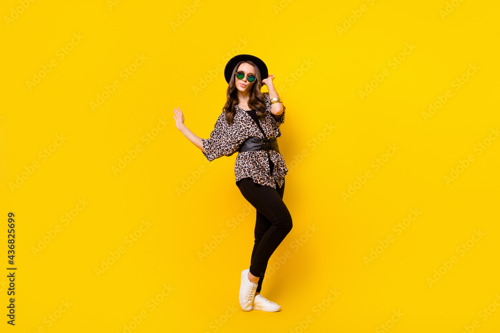 Full body photo of glamour attractive nice young woman wear luxury outfit look empty space isolated on yellow color background