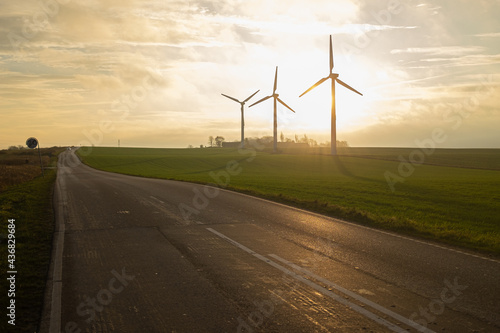 Wind turbines at sunset © asgero
