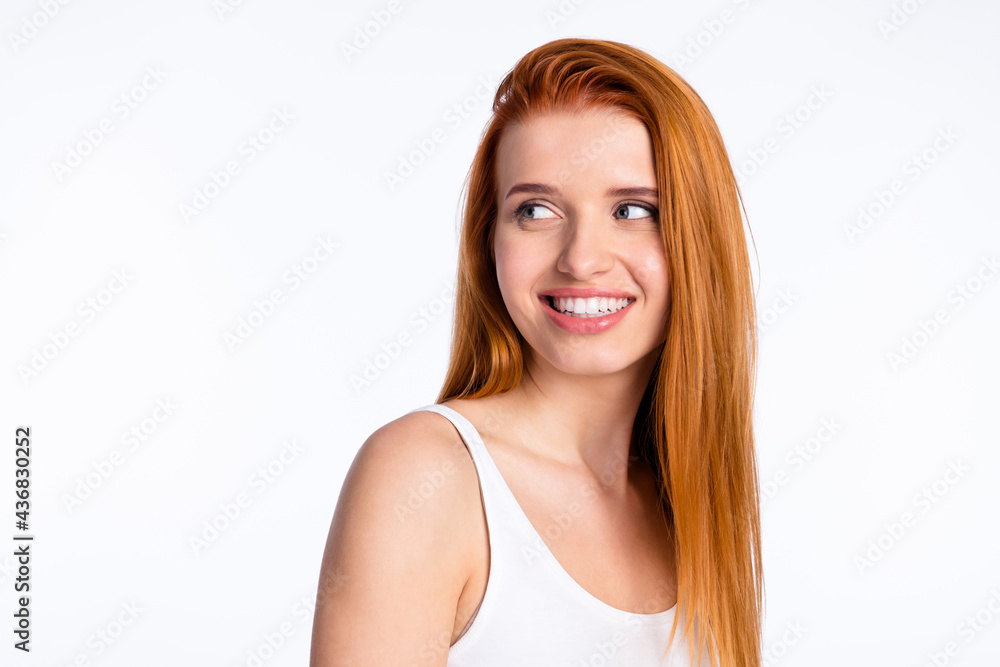 Photo of young cheerful girl happy positive smile dream curious look empty space isolated over grey color background Photo of young cheerful girl happy positive smile dream curious look empty space isolated over grey color background