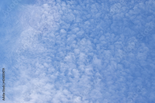 Beautiful fluffy clouds. Blue sky background