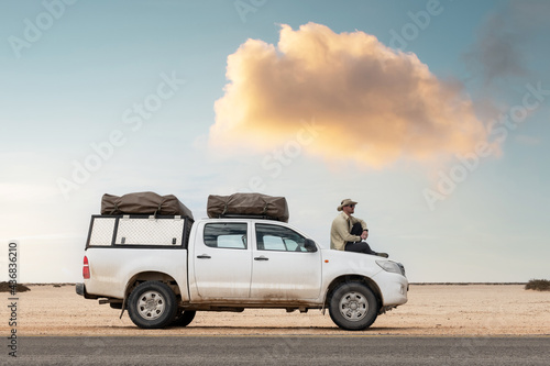 A tourist sits in his SUV