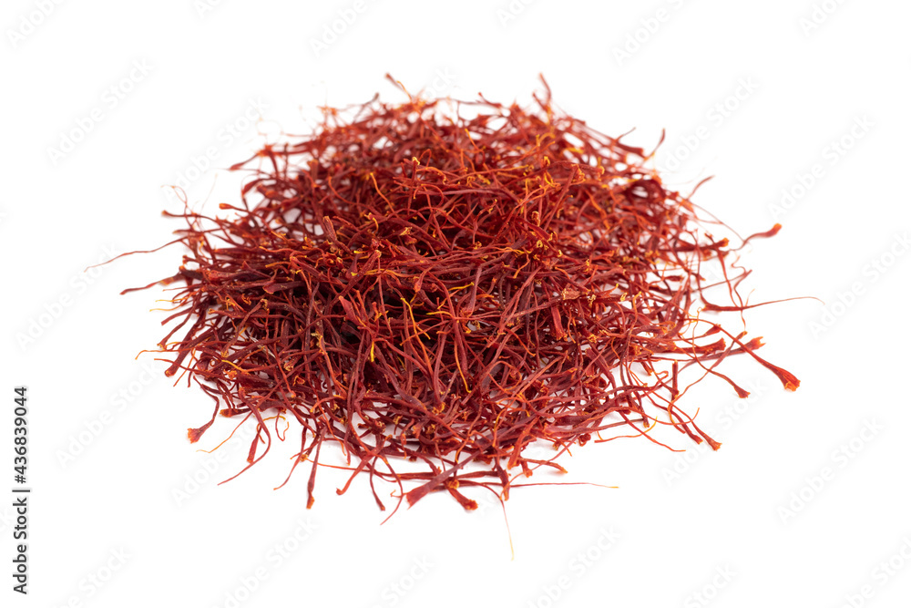 Fototapeta premium Dried Saffron threads. Oriental spices. Isolated on white background. High quality red threads from Iranian saffron.