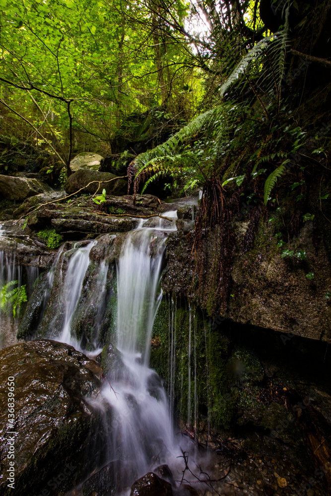 Spring waterfall in La Garrotxa, Girona, Spain Spring waterfall in La Garrotxa, Girona, Spain
