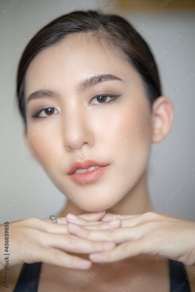 Beautiful young asian woman with clean fresh skin on white background. Asian women portrait. Beautiful young asian woman with clean fresh skin on white background. Asian women portrait.