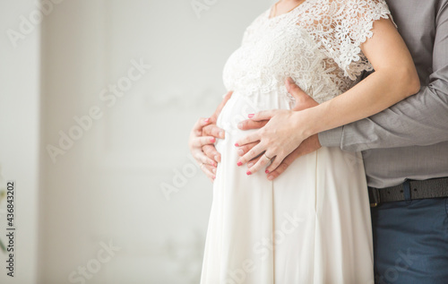 Pregnant woman in white dress