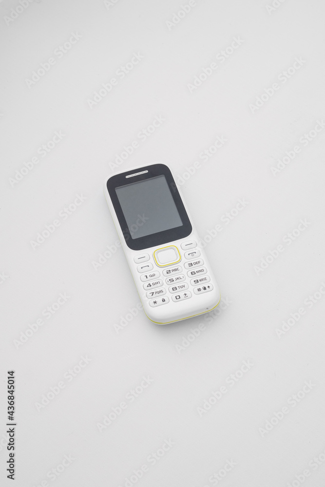White handphone on white board, White table White handphone on white board, White table