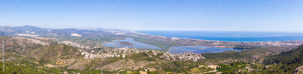 Panoramic view of Valencian coast and the Marjal wetland nature park in Pego and Oliva. View from Segaria mountain in Spain. Panoramic view of Valencian coast and the Marjal wetland nature park in Pego and Oliva. View from Segaria mountain in Spain.
