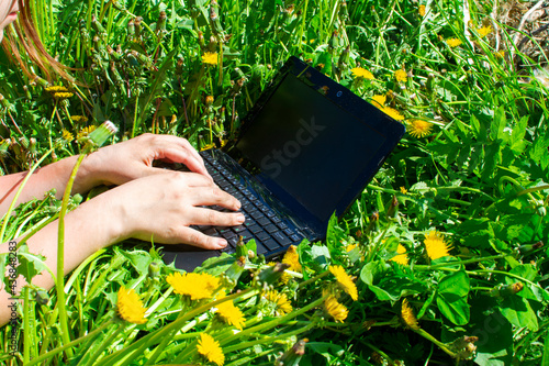 laptop in nature prints girl working