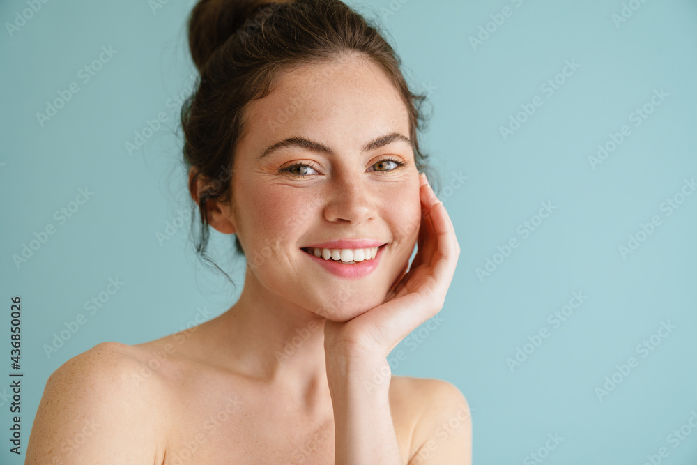 Half-naked brunette woman smiling and looking at camera Half-naked brunette woman smiling and looking at camera