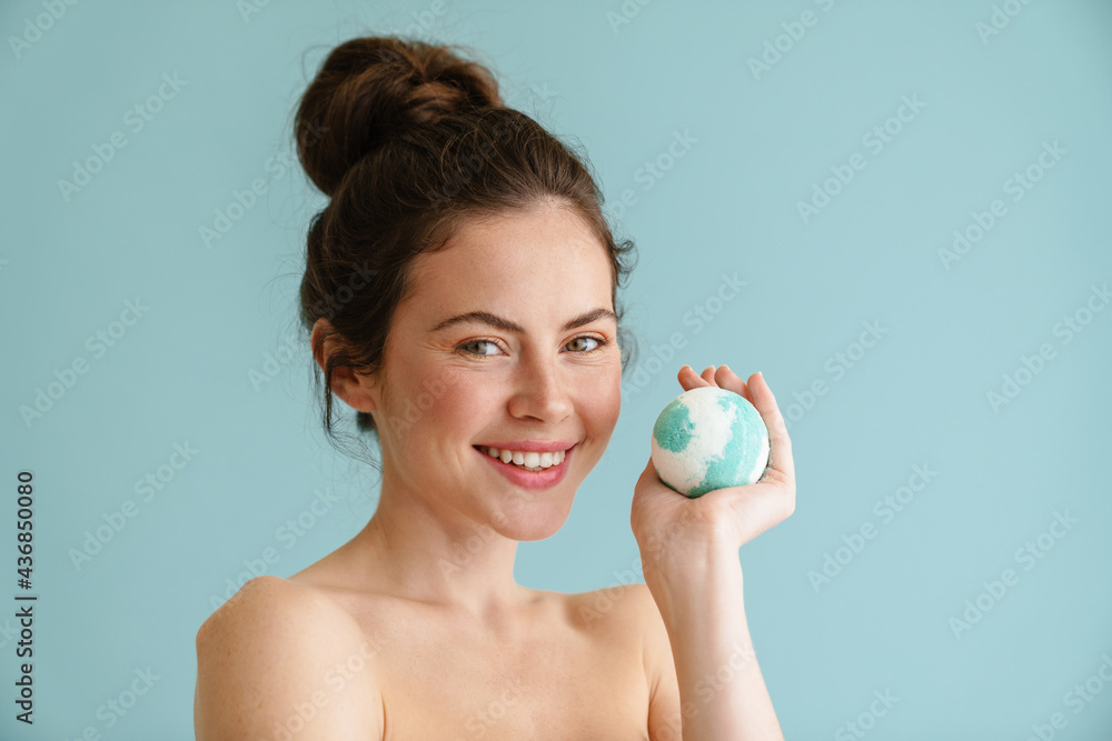 Half-naked brunette woman smiling while posing bath bomb Half-naked brunette woman smiling while posing bath bomb