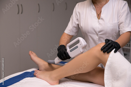 Hair removal cosmetology procedure from a therapist at cosmetic