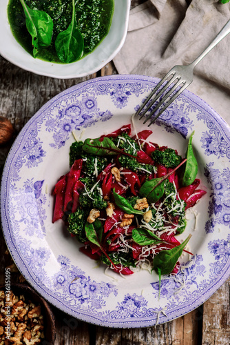 Beet pasta with spinach pesto .style rustic