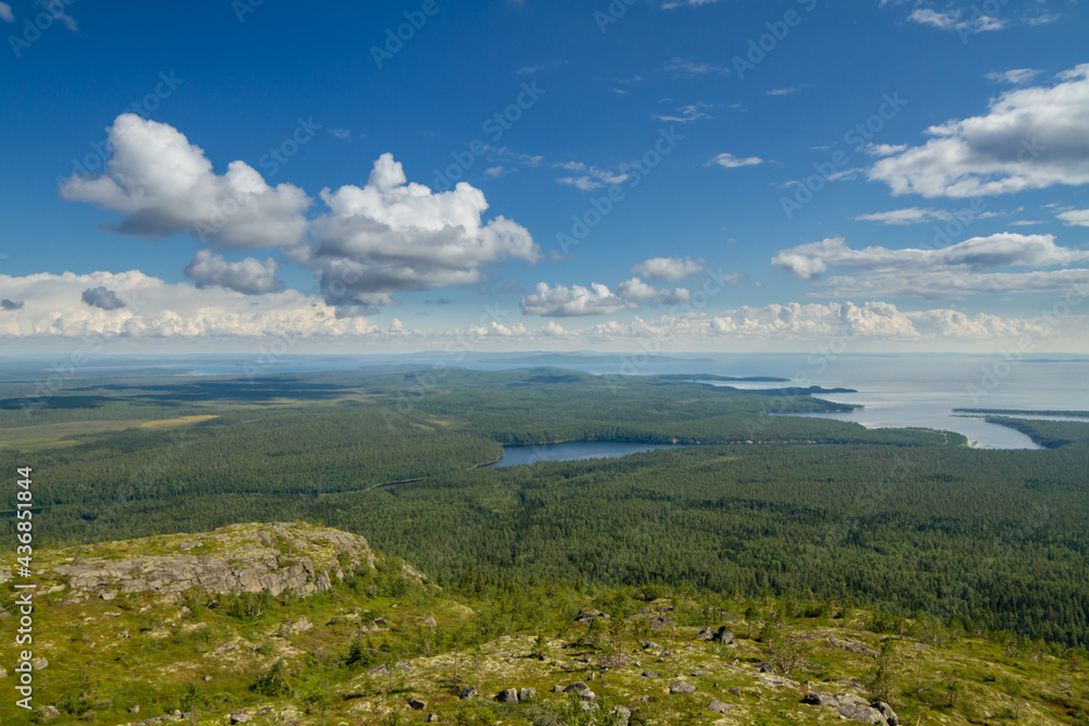 View from the mountain to the forest, river and lake. Karelia, Russia.