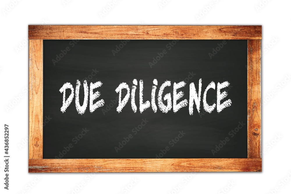 DUE DILIGENCE text written on wooden frame school blackboard. DUE DILIGENCE text written on wooden frame school blackboard.