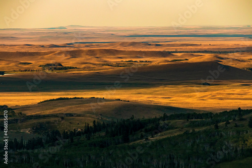 sunset illuminating the golden yellow open plains  in the Blackfeet reservation in Montana. photo