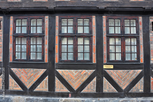 Canvas Print Architectural background: wall and windows of half timbered house