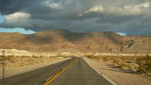 Wallpaper Mural Road trip, driving auto from Death Valley to Las Vegas, Nevada USA. Hitchhiking traveling in America. Highway journey, dramatic atmosphere, sunset mountain and Mojave desert wilderness. View from car. Torontodigital.ca