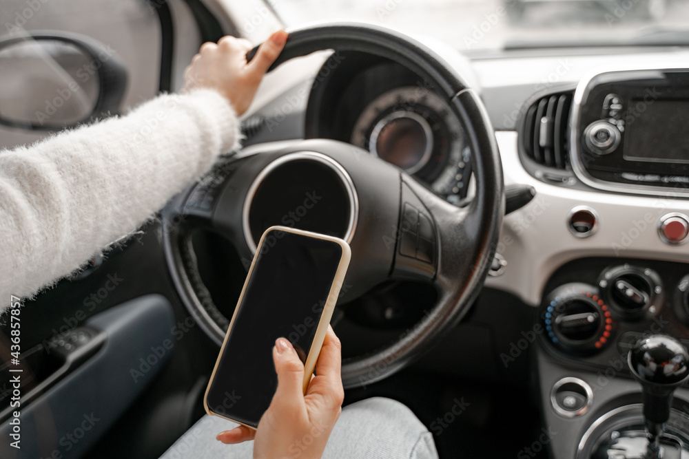 Woman use mobile phone in personal auto Woman use mobile phone in personal auto