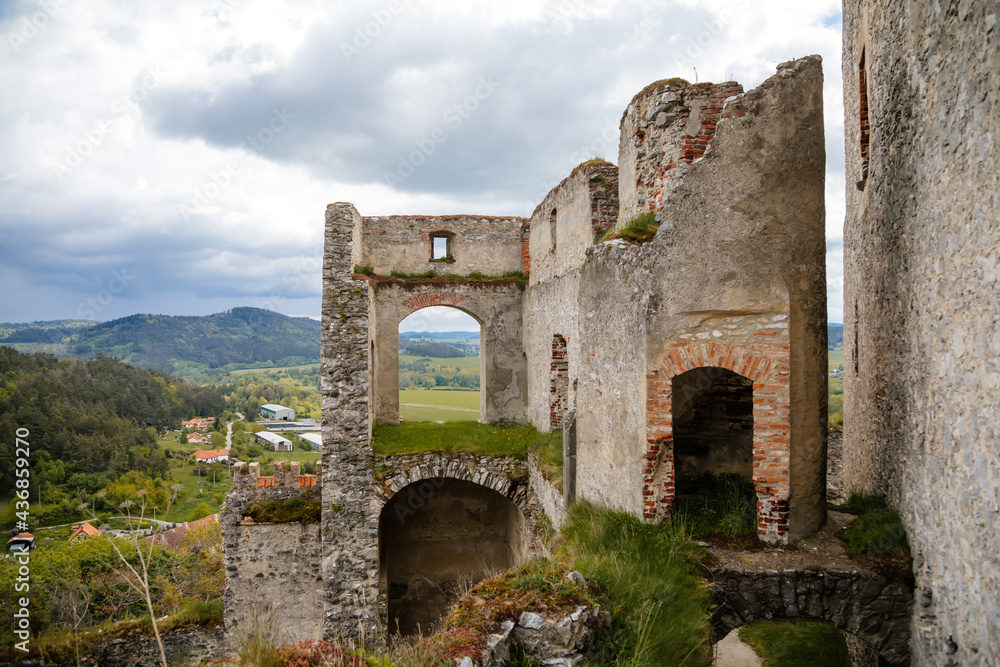 Stone gothic ruins of old medieval castle Rabi in National Park Sumava, ancient fortress in sunny spring day, landmark in countryside, stronghold on the hill, Rabi, Czech Republic Stone gothic ruins of old medieval castle Rabi in National Park Sumava, ancient fortress in sunny spring day, landmark in countryside, stronghold on the hill, Rabi, Czech Republic