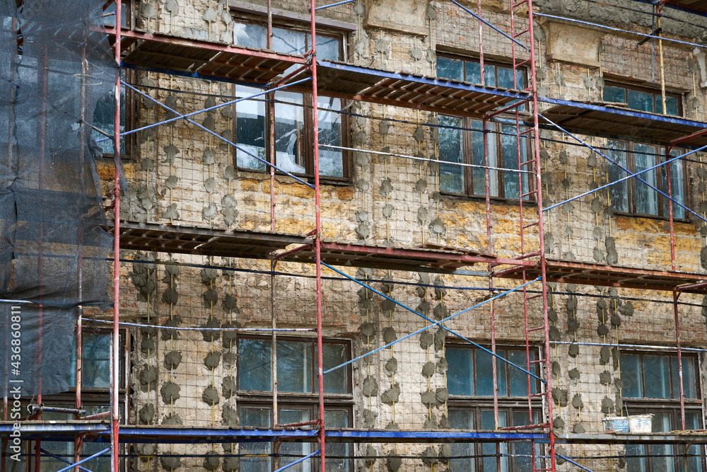 renovation or repair of a building facade using scaffolding
