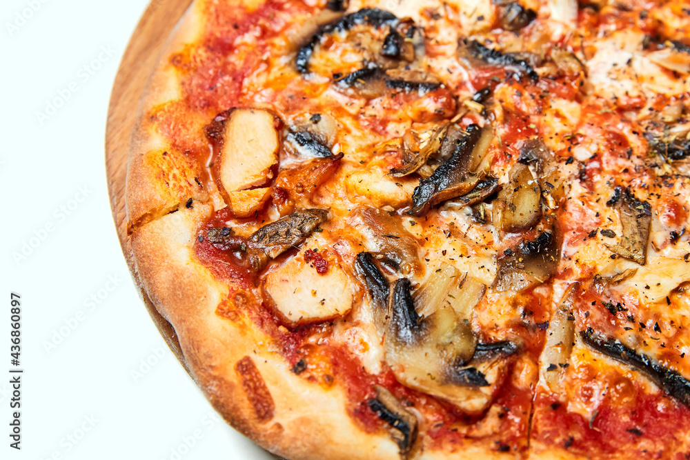 Fresh pizza with bacon, mushrooms and cheese on a light background. Close-up, selective focus Fresh pizza with bacon, mushrooms and cheese on a light background. Close-up, selective focus