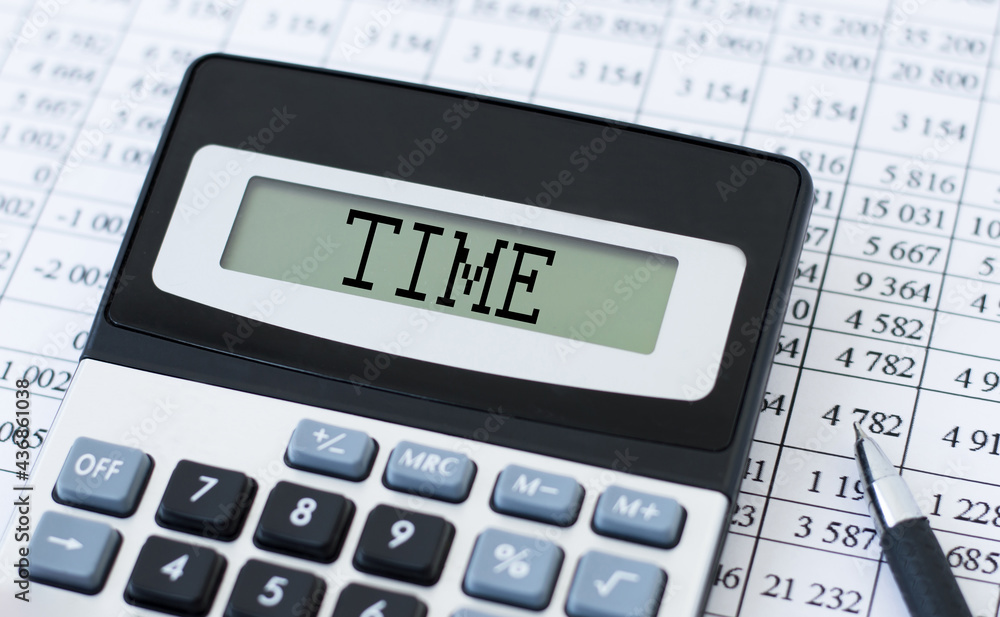 Calculator with the text TIME on display. Business, tax and financial concept Calculator with the text TIME on display. Business, tax and financial concept