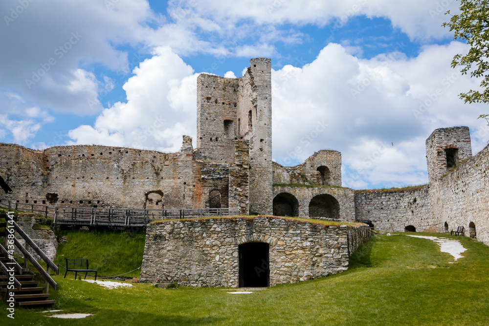 Stone gothic ruins of old medieval castle Rabi in National Park Sumava, ancient fortress in sunny spring day, landmark in countryside, stronghold on the hill, Rabi, Czech Republic