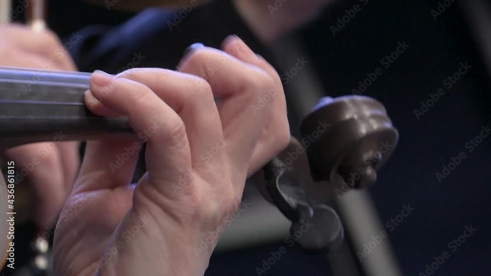 Symphony orchestra the musician's hands play a bow on the violin. Close up. Symphony orchestra the musician's hands play a bow on the violin. Close up.