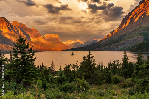 dramatic summer  sunrise in the Wild Goose Island in St. Mary's Lake in Glacier national Park in Montana. photo
