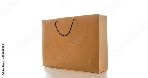 Shopping bag. Brown paper bag with kraft recycle texture, empty blank space for design mockup isolated on white background. Packaging template mock up with stitch sewing.