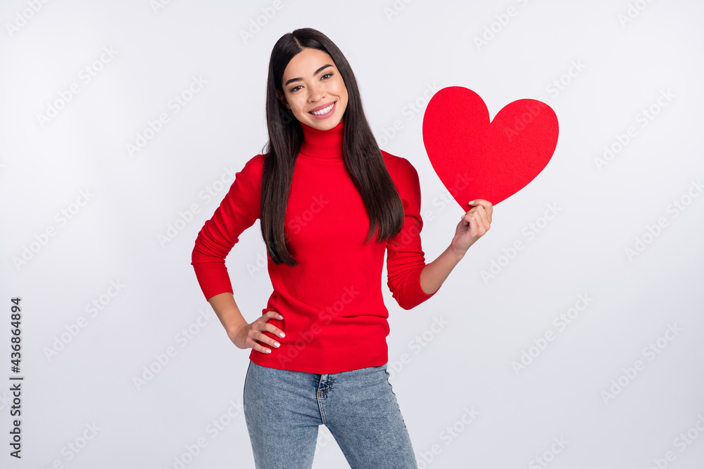Photo of happy cheerful smiling woman hold big red paper heart celebrate valentine day isolated on grey color background Photo of happy cheerful smiling woman hold big red paper heart celebrate valentine day isolated on grey color background