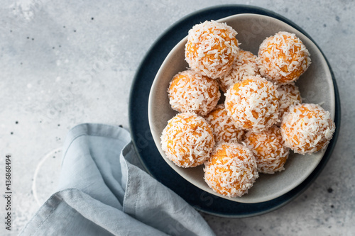 Photography apricot coconut bliss balls in blue bowl