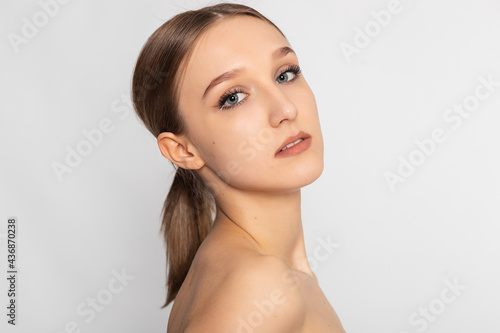 Beautiful Young Woman with Clean Fresh Skin look away .Girl beauty face care. Facial treatment . Cosmetology , beauty and spa .