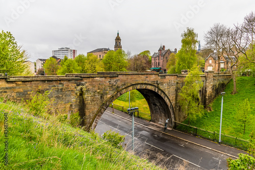 A view of the bridge from the Cathedarl Precinct leading towards the Necropolis in Glasgow on a summers evening