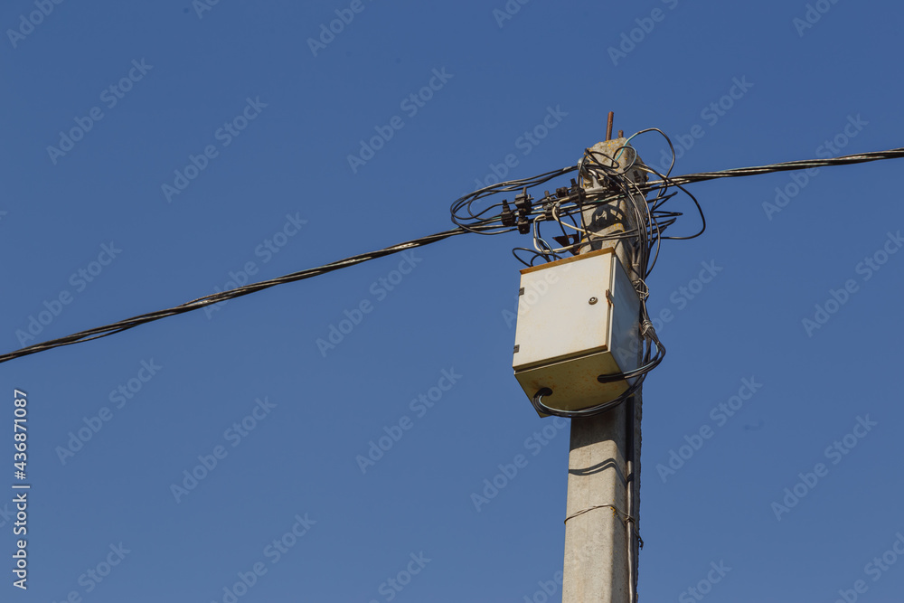 Distribution transformer box and electricity line on concrete pole Distribution transformer box and electricity line on concrete pole