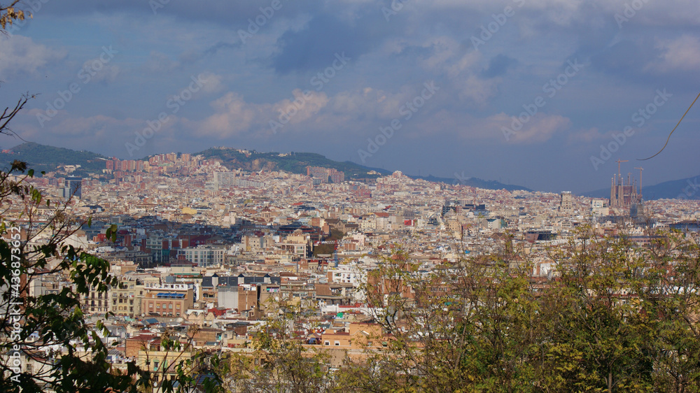 Barcelona, Catalunya: A cityscape from the famous Parc Guell, under a beautiful blue sky.