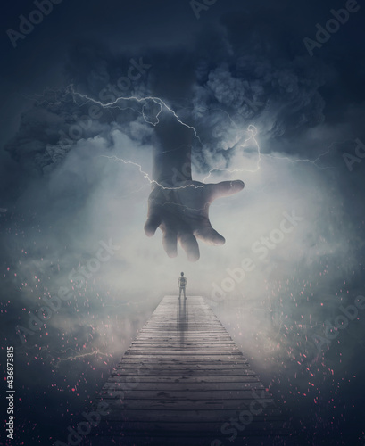Foto Surreal scene, a man on a pier and a scary giant hand comes from the mist and lightnings