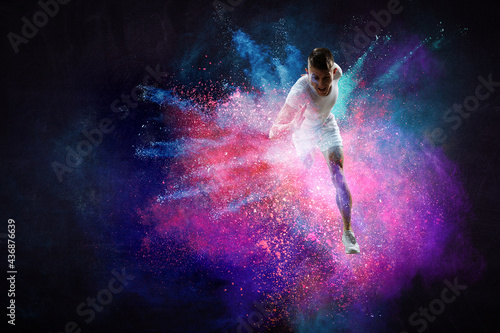 Wallpaper Mural Portrait of a fitness man running on a colourful background . Mixed media Torontodigital.ca