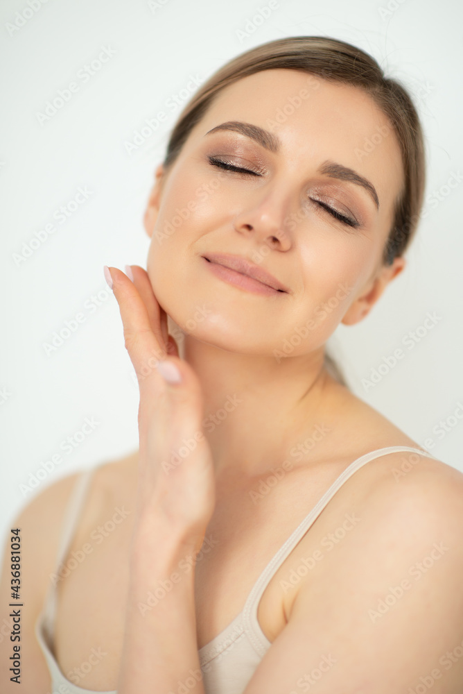 Beautiful calm middle aged woman, natural light. Anti-aging and beauty treatment. Beautiful calm middle aged woman, natural light. Anti-aging and beauty treatment.