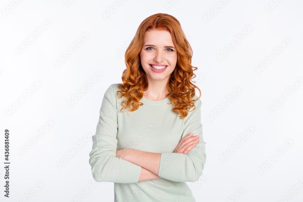 Photo portrait of young woman with crossed hands smiling confident isolated white color background with empty space Photo portrait of young woman with crossed hands smiling confident isolated white color background with empty space