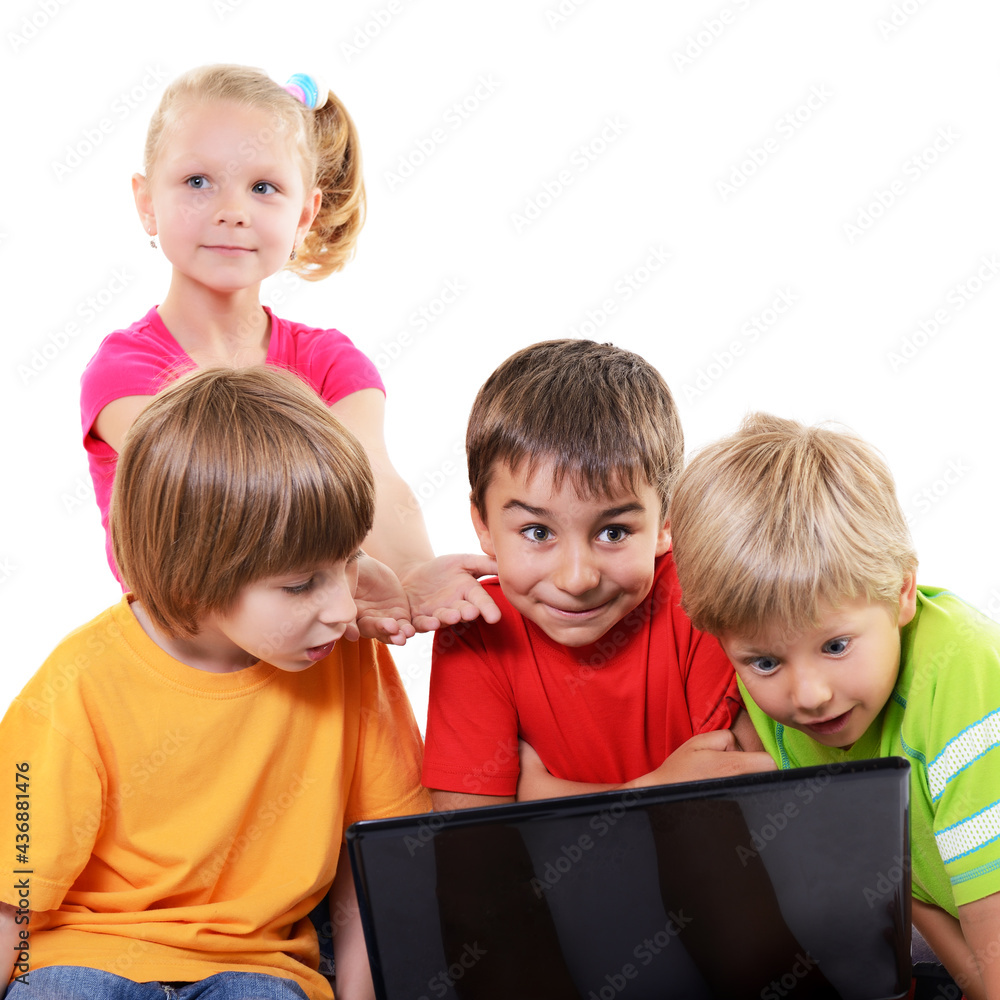 A group of primary school children with interest look at the monitor screen, isolated on white background A group of primary school children with interest look at the monitor screen, isolated on white background