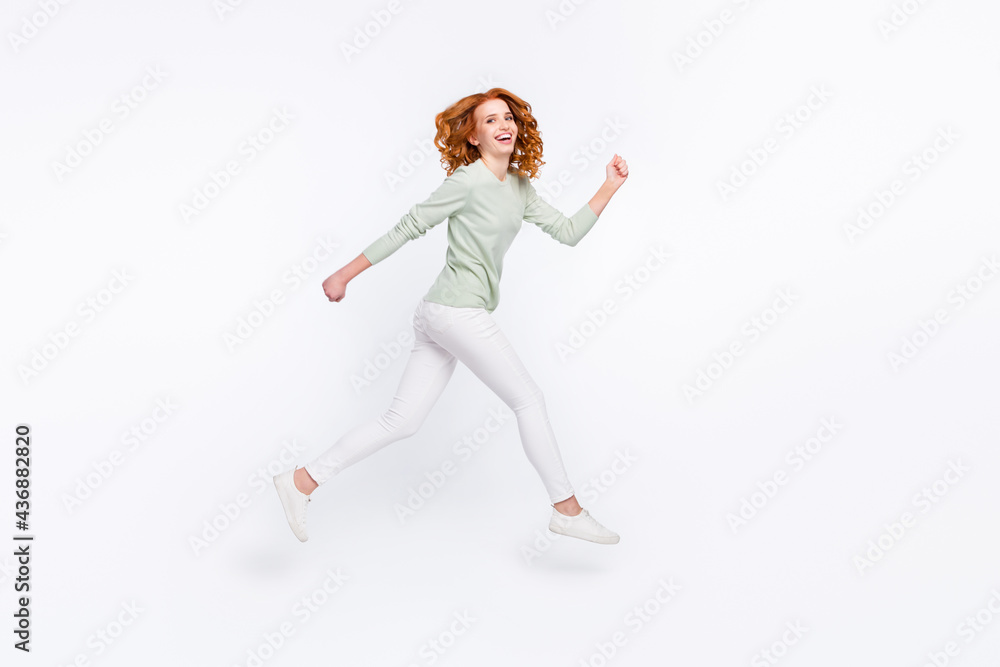 Full length body size side profile photo young woman red hair jumping high running on sale isolated white color background